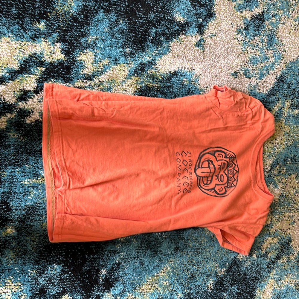 Orange T-shirt with zingcrmans, and CCCC company